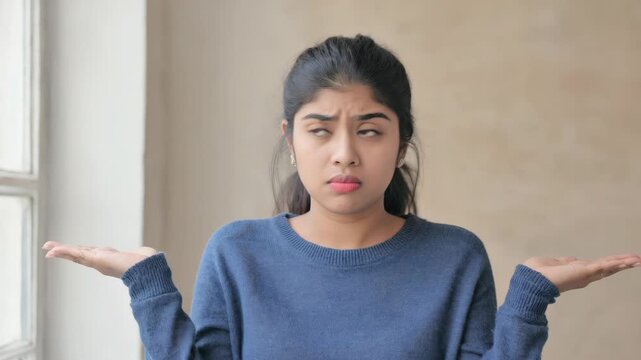 A young woman with a puzzled expression.