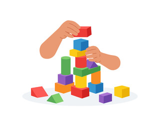 Fototapeta premium Child's hands building a colorful tower with blocks