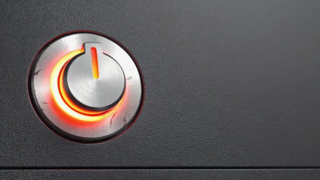 This is an of an electronic device with a start button. The button is illuminated with a red light.