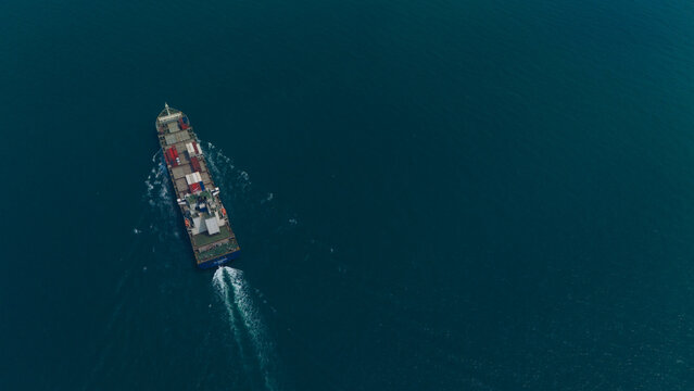 Aerial view from a container drone. Container ships in export-import and logistics business Transporting goods to large ports Worldwide shipping and logistics business International business abroad