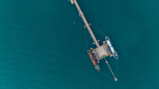 Aerial view from a container drone. Container ships in export-import and logistics business Transporting goods to large ports Worldwide shipping and logistics business International business abroad