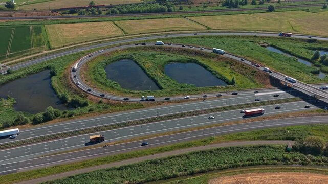 Aerial view of highway traffic and cloverleaf polder interchange
