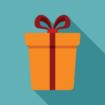 Orange gift box with red ribbon and bow creating a long shadow