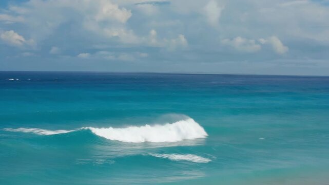 A serene beach scene with vibrant blue waters.