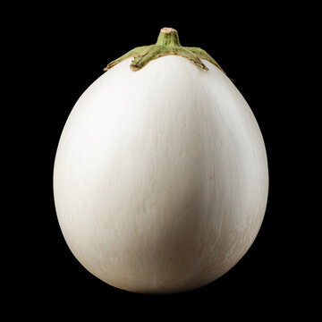 Fresh white eggplant with leaves, isolated on black background with clipping path, concept of healthy eating
