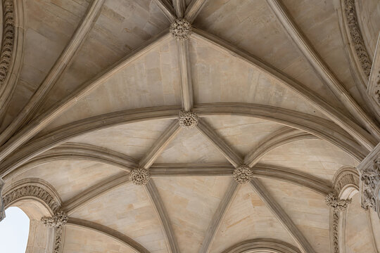 Gothic Medieval-inspired ribbed vault ceiling detail, stone texture