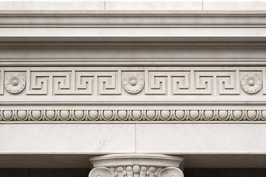 Ancient Greek-inspired marble entablature frieze detail with geometric pattern