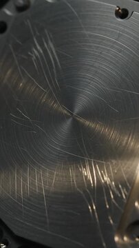 Metal Surface Rotating with Light Reflections and Scratches, Creating a Dynamic, Textured Visual Loop. and Animation