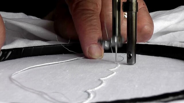Sewing machine process stitching fabric lines for garment manufacturing in textile factory in 4K Ultra HD footage.
