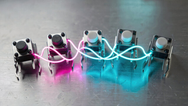 Small tactile switches connected with glowing blue and pink neon wire