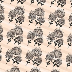 Yellow seamless botanical pattern with black floral and leaf motifs on a white background. © KarinFi