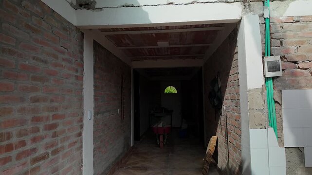 cracked hallway brick wall and structural damage after colombia earthquake