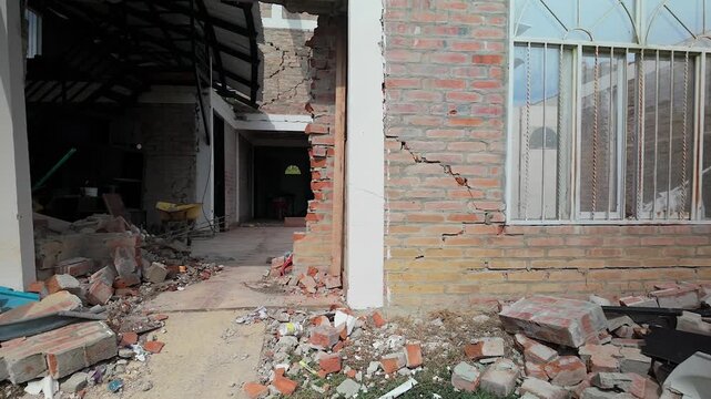 cracked walls and rubble hallway after colombia earthquake
