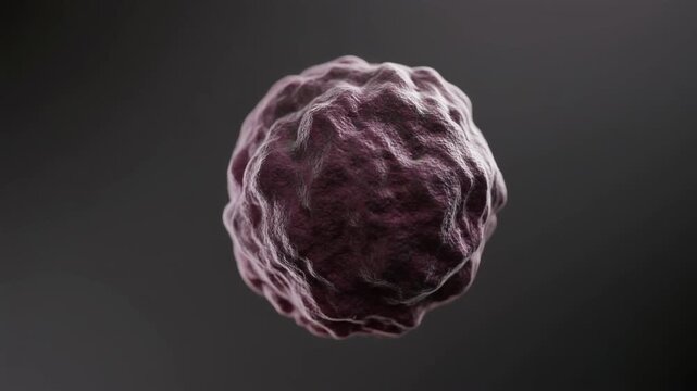 Extreme macro footage of a single compact melanoma cell structure with detailed irregular surface