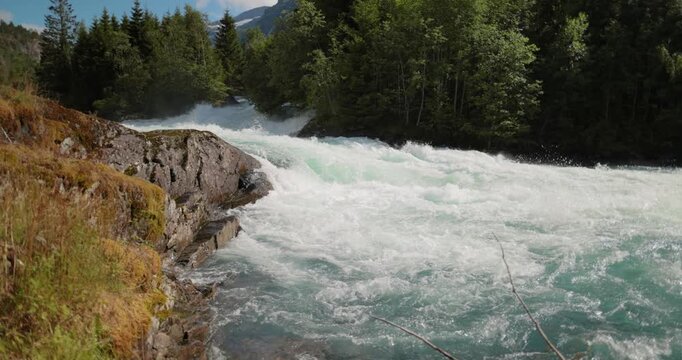 Mountain River Beautiful Nature Norway natural landscape. Lovatnet lake (also Loenvatnet) is a lake in the municipality of Stryn in Vestland county, Norway.