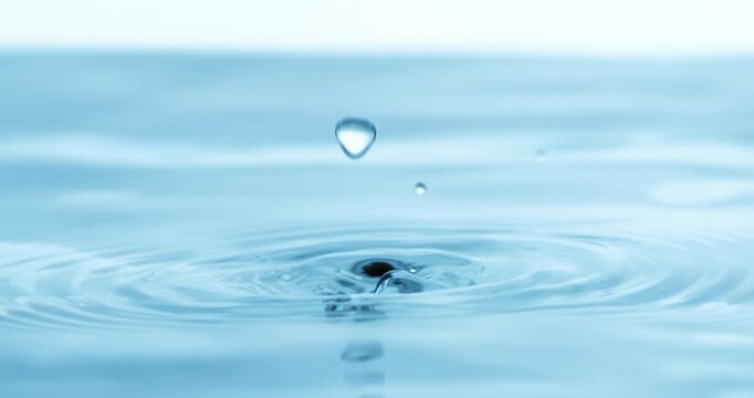 Water Drops close-up of water falls in a super slow motion. Shot on super slow motion camera 1600 fps.
