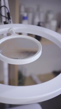 Circular ring light glowing in a quiet beauty studio