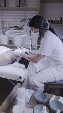 Beauty therapist preparing tools before a skincare treatment