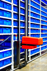 Automated storage and retrieval system with robotic arm in modern warehouse facility © I Viewfinder