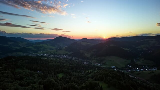 Aerial Hyperlapse Fly Forward over Summer Mountain Valley at Sunset