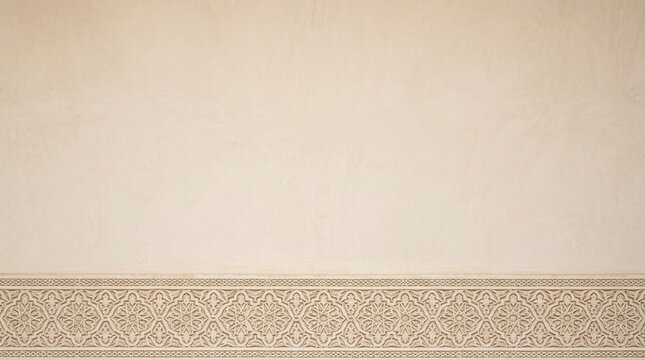 Traditional Moroccan Carved Stucco Plaster Border on a Textured Beige Wall