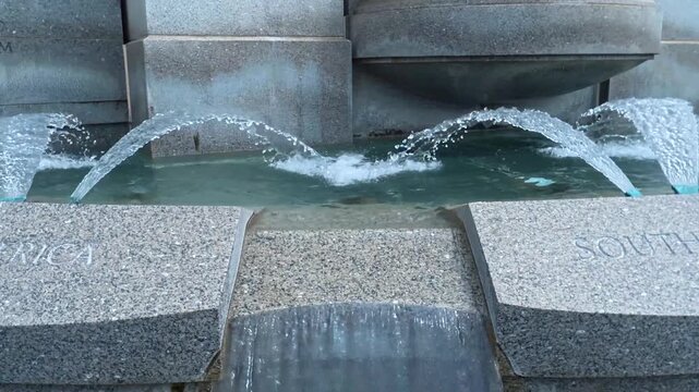 Travel and Landmarks: Close Up View of Water Jets in Rainbow Pool Fountain at National World War II Memorial in Washington DC