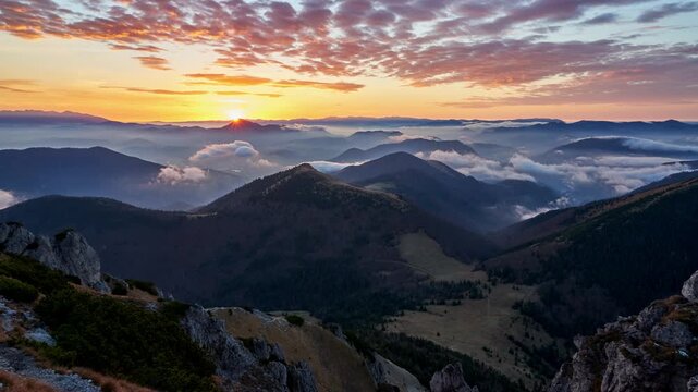 Sunrise Over Mountain Peaks with Cloud Inversion Timelapse