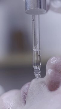 Precision tool applies droplet during focused eyelash treatment session