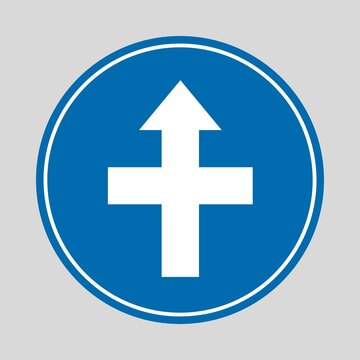 Blue circular mandatory traffic sign with a bold white arrow pointing straight and sideways, indicating permitted directional movement.