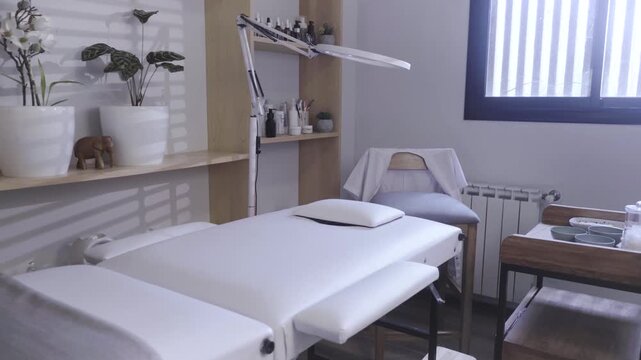 Empty beauty treatment room bathed in soft morning light