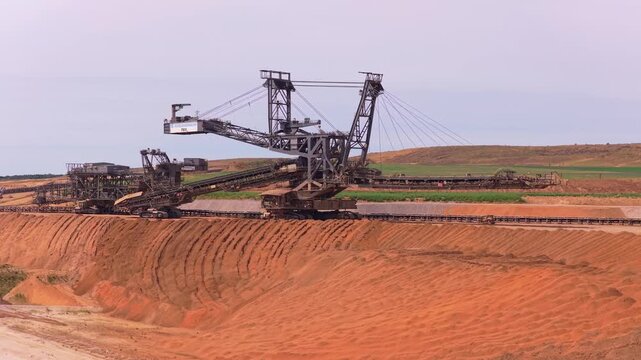 Giant bucket wheel excavator operating in lignite open pit mine