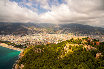 Naklejka premium Alanya Castle Kalesi and Ehmedek fortress with panoramic view over city beach and Taurus Mountains Turkey