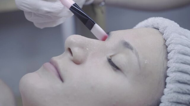 Precise cotton swab application during a relaxing facial treatment