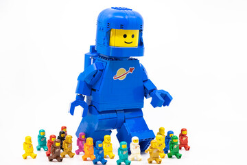 Fototapeta premium Hong Kong, June 8, 2026: A giant spaceman stands behind a lineup of eleven classic space minifigures.