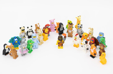 Fototapeta premium Hong Kong, June 8, 2026: A caveman holds a blazing torch among animal minifigures, symbolizing the discovery of fire and the dawn of civilization.