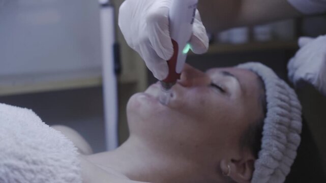 Illuminated skincare device gliding near the nose during a serene facial treatment