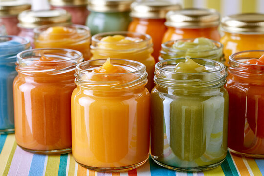 Various colorful glass jars filled with fruit jams and preserves glass jar fruit jam