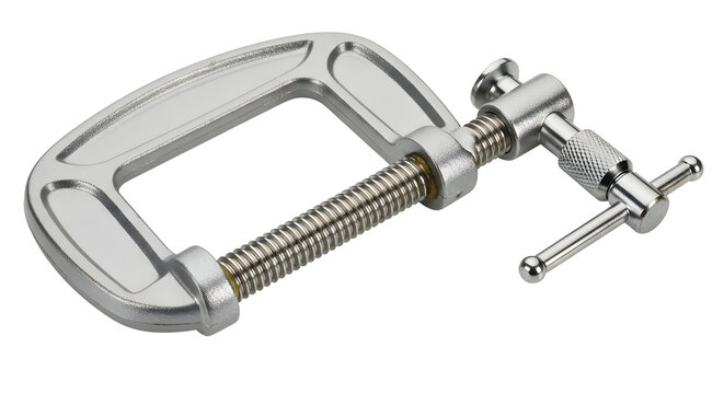 Metal C-clamp hand tool isolated on a white background for construction woodworking and DIY projects