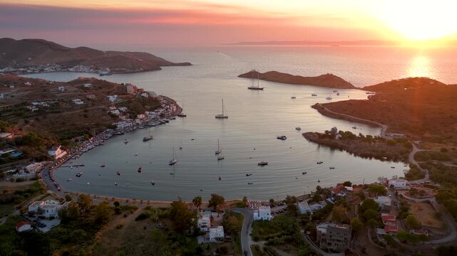 Beautiful aerial summer sunset view of the bay of Vourkari with numerous moored sailboats at Kea - Tzia island, Cyclades, Greece