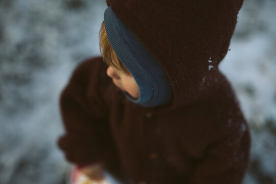 High angle view of male toddler wearing hood sweater