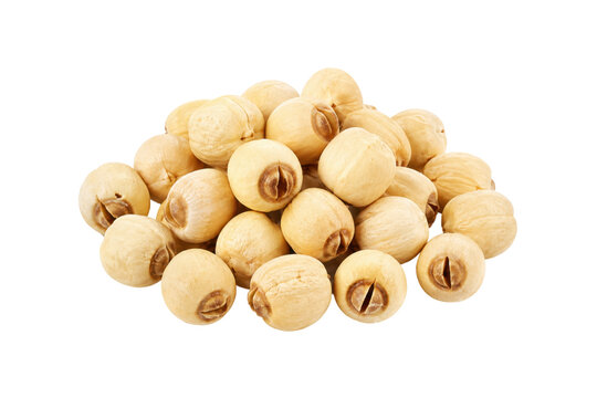 Pile of dried lotus seeds isolated on a clean white background, featuring natural pale yellow tones, subtle surface texture, and organic shapes, commonly used in Asian cuisine, desserts, soups, tradit