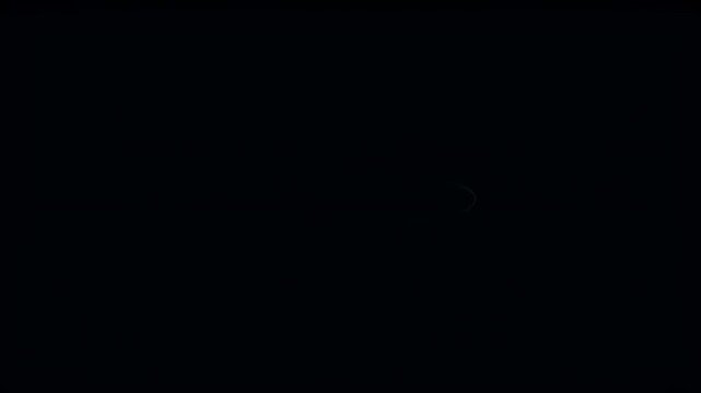Abstract light trails forming an elliptical shape against a dark background, creating an ethereal atmosphere