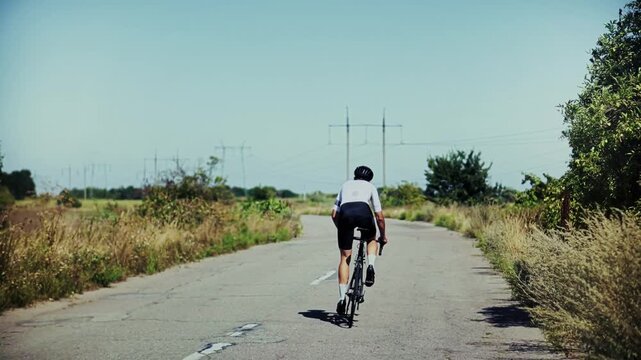 Cyclist Riding Road Bike On Asphalt Countryside Highway 