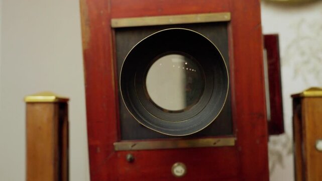 Vintage large format wooden camera lens zooming in