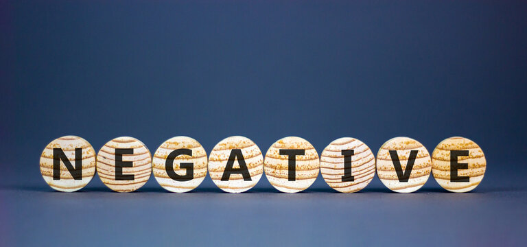 Negative word symbol. Concept word Negative on beautiful wooden circles. Beautiful grey background. Business support help negative word concept. Copy space.