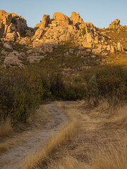 Fototapeta premium Trail meandering into rocky mountain landscape 