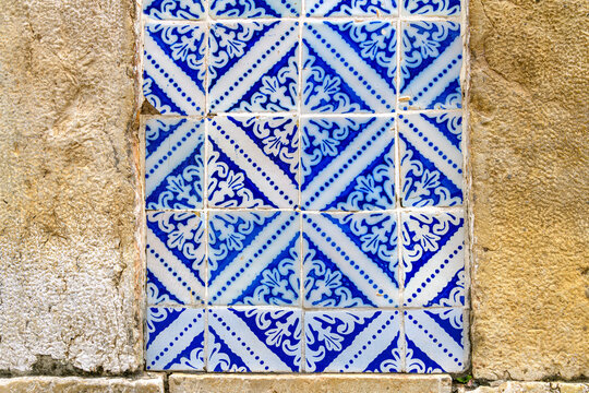 Stone wall decorated with historic tiles in Sao Luis, Maranhao.