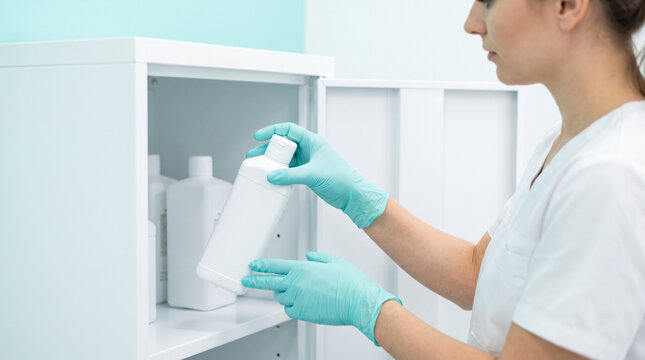 Sterilization and infection control, Woman Changing GlovesCabinet