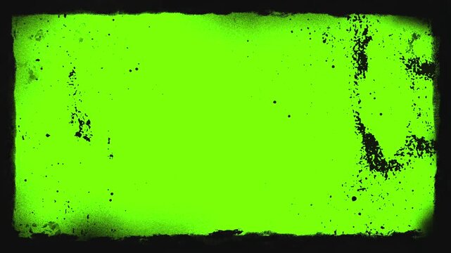 Abstract grunge distress texture frame overlay motion video. Black border with scratches and paint splatters on green screen for urban video production and photo design.