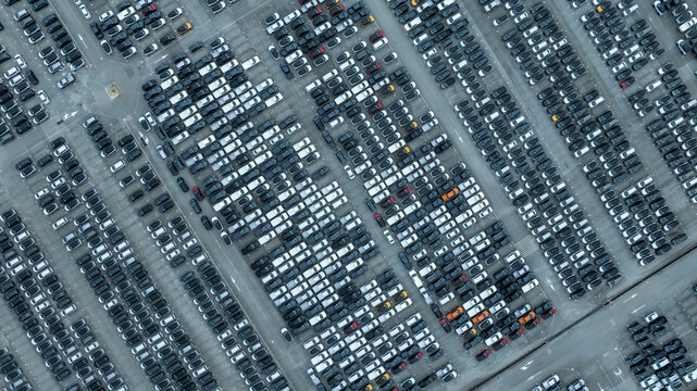 This EV car awaits shipping. Each EV car gets loaded. The EV car goes overseas.